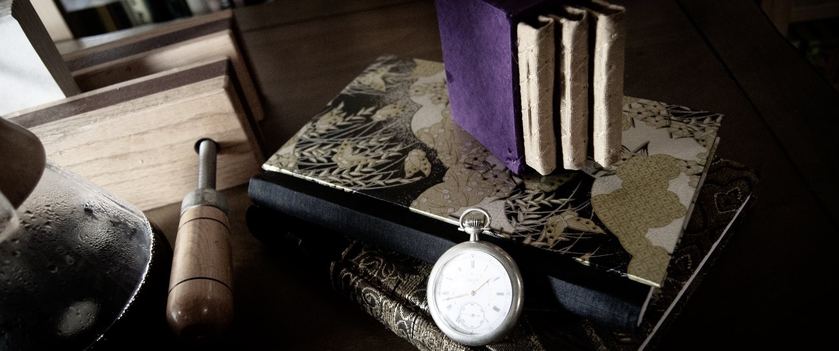 Still life with books and pocket watch